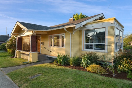 Welcome to this sunny craftsman cottage with a covered porch and quiet neighborhood charm.