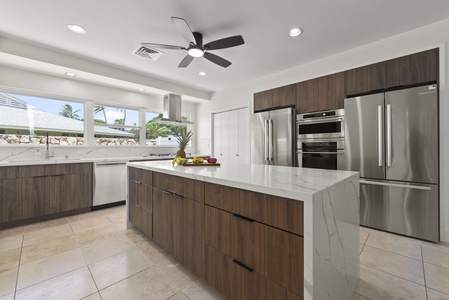Sleek cabinetry and stainless steel appliances for effortless vacation cooking.