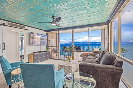 Relax in this stylish living room, featuring an oceanfront view, plush seating, and a serene atmosphere.