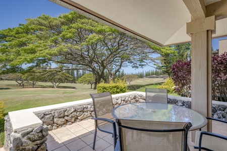 Covered lanai with table for four is ideal for tropical breakfasts or sunset cocktails.