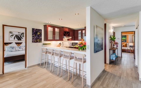 Gaze out at the golf course and distant ocean while lounging in the living room—your private window to paradise.