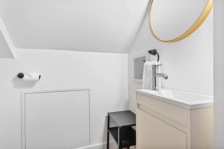 The upstairs half bath adds comfort and privacy for guests staying on the upper level.
