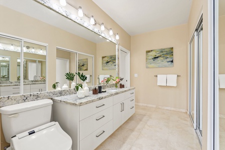 The primary bathroom features double vanities, ample storage, and sophisticated finishes—your personal spa retreat.