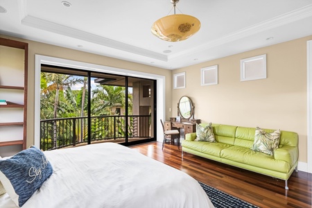 King suite with lounge area and views through floor-to-ceiling windows.