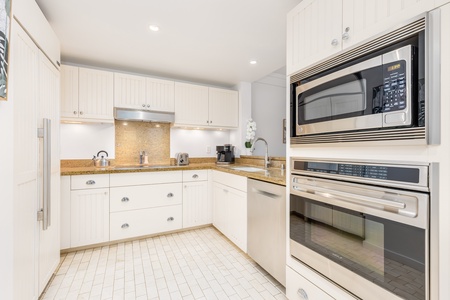 Step into your fully equipped kitchen with granite counters, stainless appliances, and everything you need for comfortable meal prep during your stay.