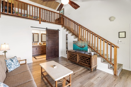 Relax in a spacious living area, where vaulted ceilings and a cozy loft invite you to unwind.