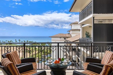 The fully equipped kitchen with bar seating and tropical views.