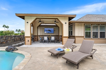 Shaded lanai and loungers make outdoor living effortless.