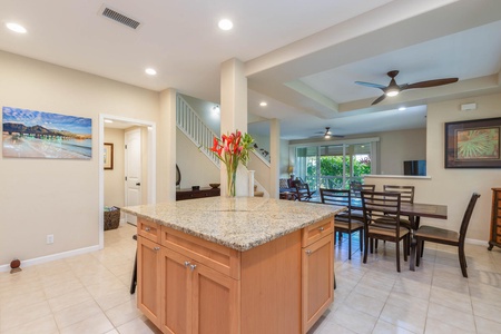 The kitchen features a spacious island bar for quick meals and entertaining.