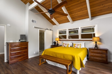 Access to the Lanai from the Primary bedroom with TV