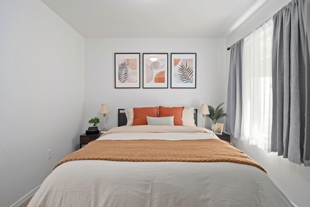 Comfort meets simplicity in this calming queen bedroom, designed for uninterrupted rest and relaxation.