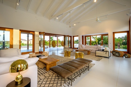 Relax in the living area with plush sofas.