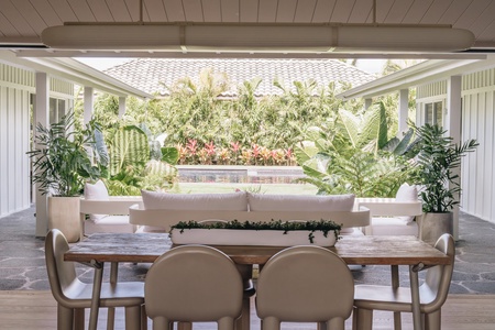 Gather for relaxed meals and conversation in this shaded outdoor dining space.