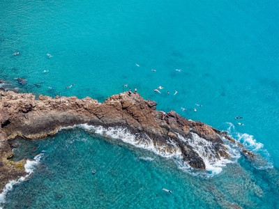 Lava-rock shores and turquoise water promise adventure near Honua Kai Konea 204.