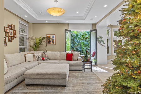 Open family room with elegant design and large windows.