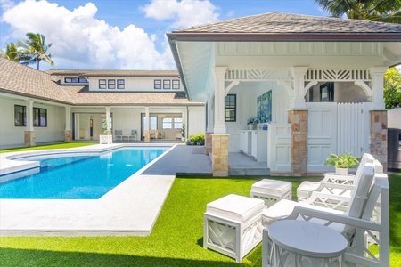 Grand great room with vaulted ceilings, designer lighting, and seamless indoor‑outdoor flow.