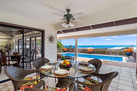 Dine alfresco by the pool with stunning ocean views.