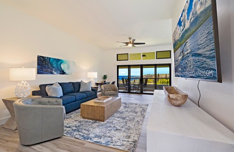 Dine with ocean views at Kapalua Ridge 1421, framed by large windows and sliding doors.