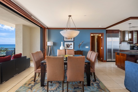 Gather around your elegant dining table with ocean views, where memorable meals unfold against stunning blue waters.