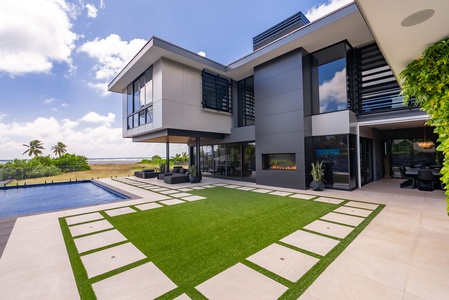 Ocean-facing lanai and expansive lawn complete this luxurious Hawaiian escape.