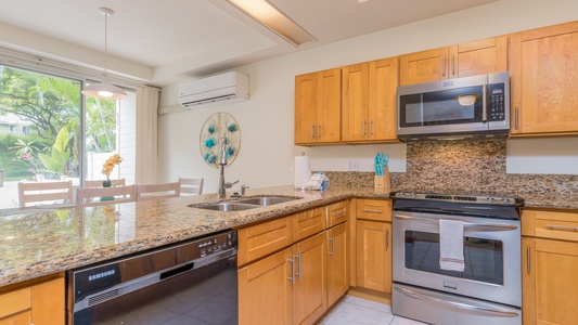 The kitchen is open and bright for entertaining.