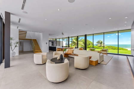Open the glass walls and let ocean breezes flow through this expansive living space.