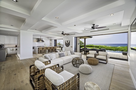 Open concept living room with built in 80 inch TV, Restoration Hardware furniture from their Luxury Beach Edition
