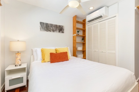 Clean and inviting, this bedroom with queen bed and AC offers restful sleep after a day exploring the North Shore.