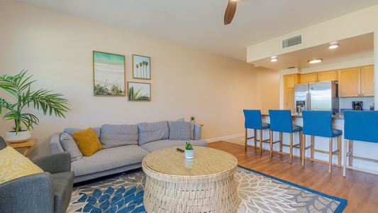 Sink into the plush seating in the living area surrounded by natural wood tones.