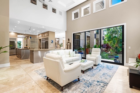 Spacious seating area with pool access and natural light.