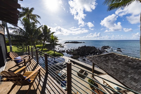 Oceanfront deck with loungers, perfect for soaking up the sun.