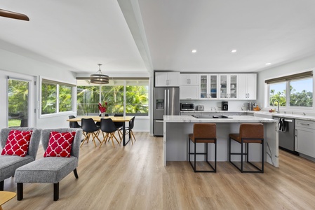 This open floor plan seamlessly connects the modern kitchen with the dining area, perfect environment for both cooking and socializing.