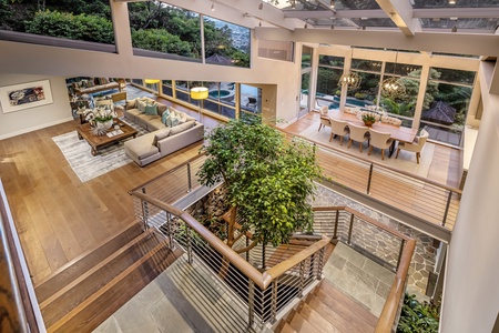 Elegant dining room with vaulted glass ceiling and mountain-to-sea views—ideal for memorable meals together.