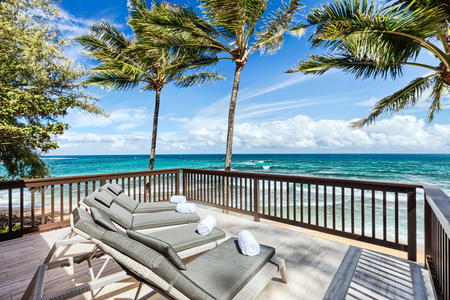 Watch the sun set over the ocean, framed by swaying palms, for a truly unforgettable tropical experience.