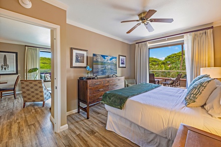 The primary suite at Honua Kai Konea 232 features a king bed and direct access to the lanai.