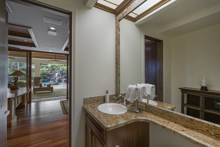 A stylish half bath with designer finishes adds comfort and convenience.