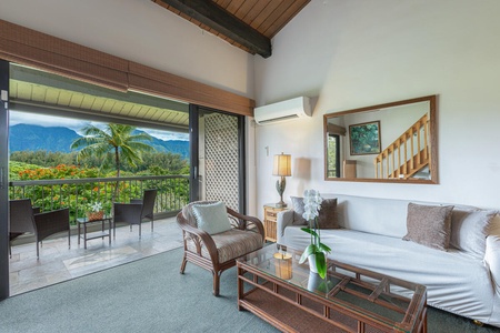 Comfortable living room with plush seating and easy access to the private lanai.