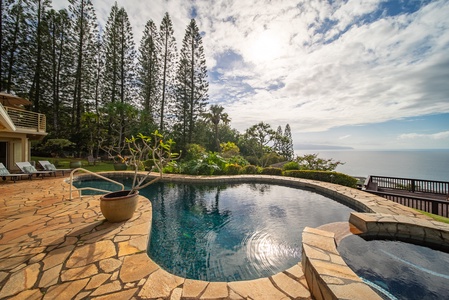 Private pool overlooks endless ocean views, where your morning swims meet breathtaking sunrises and tropical breezes through towering pines.
