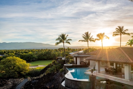 Sunset soaks the horizon as the infinity-edge pool glows above the fairway—a signature evening at Champion Ridge 7.