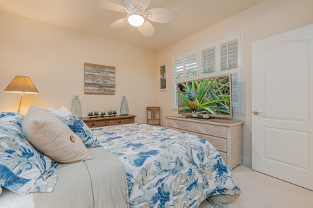 Cozy guest bedroom with an airy ambiance.