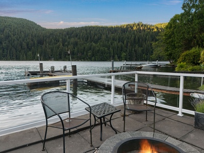 A fire pit on the waterfront deck, set for the evening to wind down.
