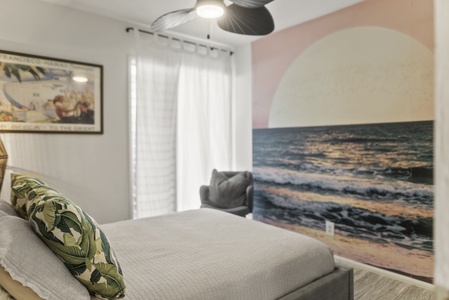 Vibrant suite with a tropical mural and cozy bedding, creating a cheerful island-inspired retreat.