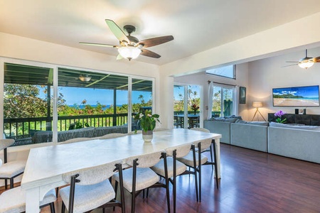 Unwind in the shaded lanai lounge area with comfortable seating and a BBQ grill, perfect for afternoons of grilling and laughter with loved ones.