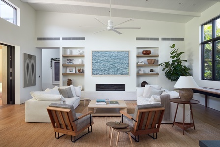 Settle into the heart of the home, where soaring ceilings, natural light, and garden views create an inviting space to gather, relax, and reconnect.