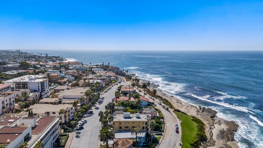 Sweeping aerial view showcases proximity to the ocean and scenic coastline.