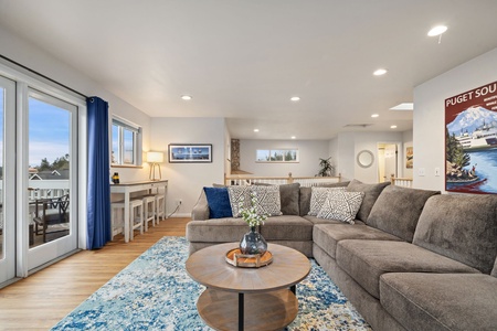 Relax in this bright living space with plush sectional seating, flowing into your dining area with patio access.