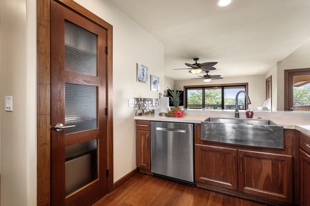 Modern kitchen with rich wood cabinetry, stainless steel appliances, and ample counter space.
