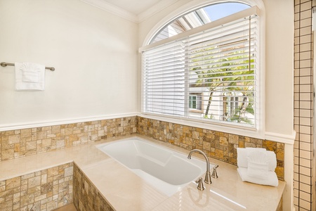 Large soaking tub in room 1