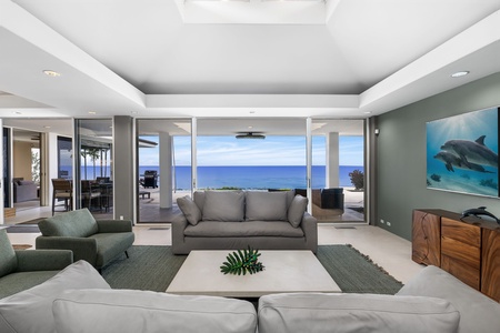 Relax in your stunning oceanfront living room with panoramic sea views and contemporary comfort.