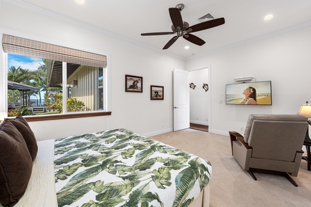 This bedroom features a king bed, and a large en suite with a walk-in shower, and is located nearby the detached game room.
